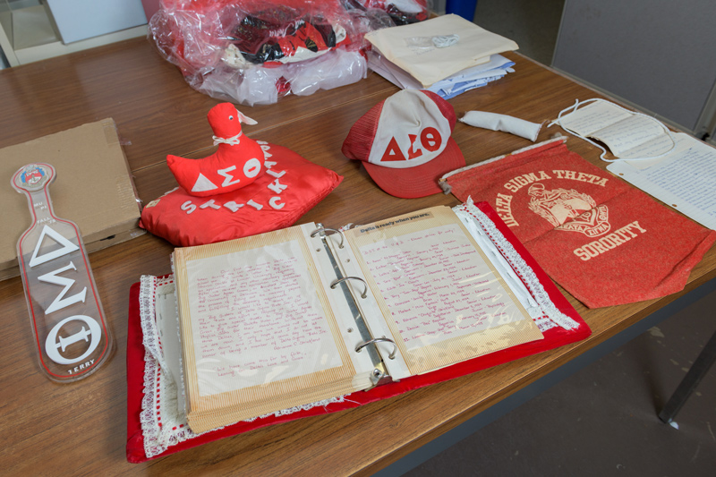 Alumnae of the Mu Pi chapter of Delta Sigma Theta, the first African American sorority at the University of Delaware, donate memorabilia — including newsletters, t-shirts, door knockers, paddles and more — to the University Archives.