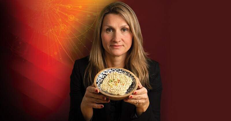 UD associate professor Allison Karpyn, who studies access to healthy food, holds a bowl of ramen noodles, an easily accessible, but often unhealthy dinner option. 