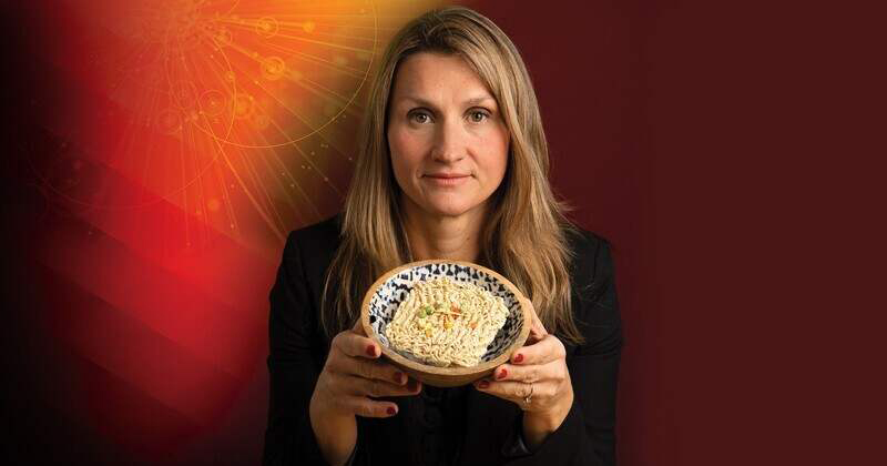 UD associate professor Allison Karpyn, who studies access to healthy food, holds a bowl of ramen noodles, an easily accessible, but often unhealthy dinner option.