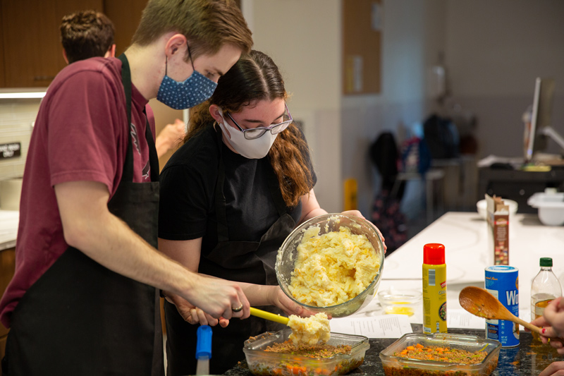 Students cooking Adjunct instructor Brittany Knick’s “Cooking Around the World'' class is one of the most popular classes taught in the Department of Behavorial Health and Nutrition. Each week, students explore recipes from a new country. Pictured here, students focused on Irish cuisine for St. Patrick’s Day.