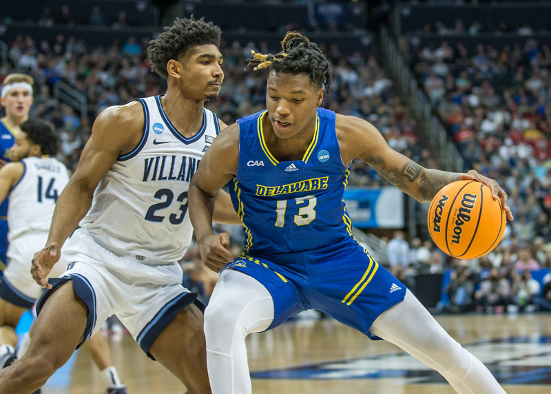 University of Delaware forward Jyare Davis (13) drives against Villanova’s Jermaine Samuels during their NCAA Tournament first-round game on Friday, March 18, in Pittsburgh. Davis led UD in scoring 17 points.
