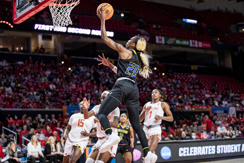 The University of Delaware’s Jasmine Dickey drives to the basket to score two of her game-high 31 points during the Blue Hens’ NCAA Tournament loss to the University of Maryland.