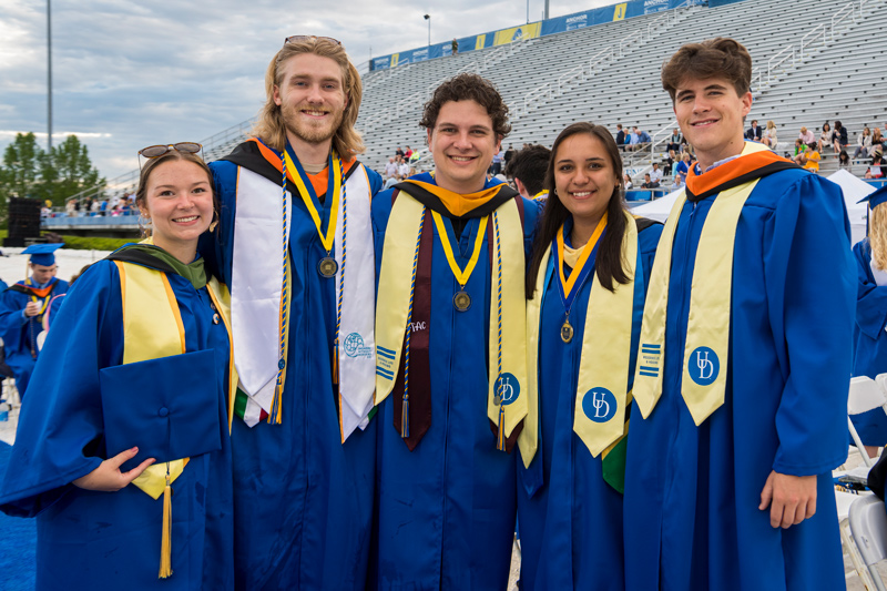 Alex Newkirk, second from left, earned an honors bachelor of mechanical engineering. “It's really nice that we're back here in person to finally finish everything up and have a satisfying end to our college careers,” he said.