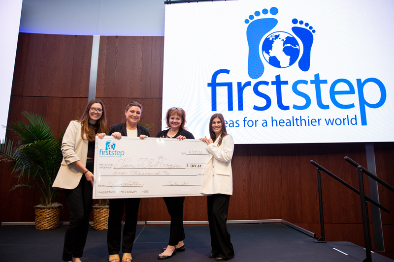 From left to right, sophomore Alexis Nappa and junior Grace Inman stand with community partner Nicole Fullmer, director of community engagement at Delaware Hospice, and fellow teammate, senior Madison Fox. The Delaware Hospice team won $1,000 for coming up with the most innovative solution at this year’s First Step competition. 