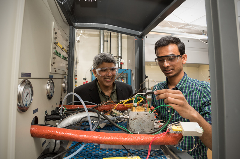 A costly failed part on UD’s hydrogen fuel cell bus led Professor Ajay Prasad (pictured left) and colleagues to devise a solution, protype a new part and bring it to market through their own startup company.