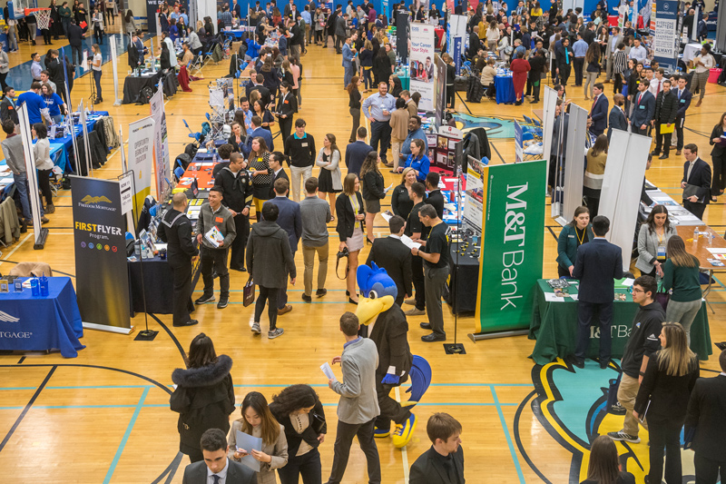 UD job and internship fair, pre-pandemic Students graduating this year will enter the workforce in what is one of the strongest job markets in recent years, with employers planning to hire 31.6% more new graduates from the Class of 2022 than they hired from the Class of 2021, according to the National Association of Colleges and Employers Job Outlook 2022 Spring Update survey. In a photo taken before the coronavirus pandemic necessitated wearing masks, social distancing and remote classes and activities, students attend a career and internship fair.