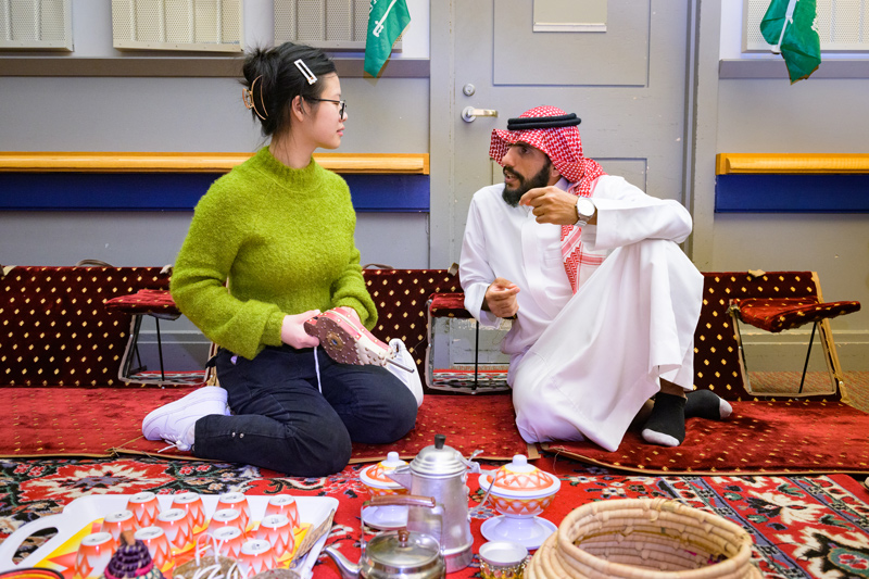 Two students share a quiet moment of conversation at the Festival of Nations.