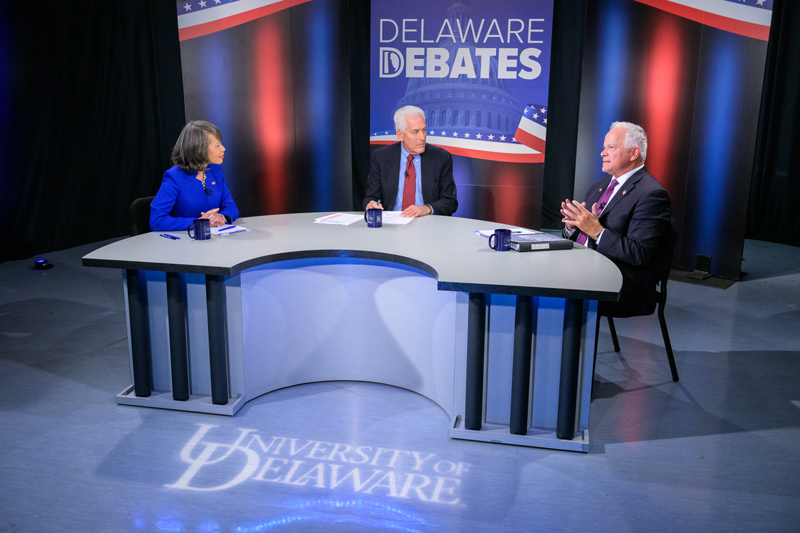 The 2022 candidates for Delaware’s lone seat in the U.S. House of Representatives — Democratic incumbent Lisa Blunt Rochester and Republican candidate Lee Murphy — participated in “Delaware Debates 2022,” which was moderated by Ralph Begleiter (middle). Hosted by UD’s Center for Political Communication and Delaware Public Media, the debate was the only one scheduled for the candidates. The 2022 candidates for Delaware’s lone seat in the U.S. House of Representatives — Democratic incumbent Lisa Blunt Rochester and Republican candidate Lee Murphy — participated in “Delaware Debates 2022,” which was moderated by Ralph Begleiter (middle). Hosted by UD’s Center for Political Communication and Delaware Public Media, the debate was the only one scheduled for the candidates.