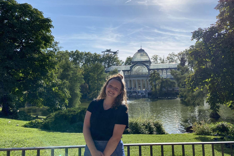  Junior Ali Giffen stands outside Palacio de Cristal in the Parque del Retiro in Madrid, Spain, during her time abroad with the World Scholars Program.