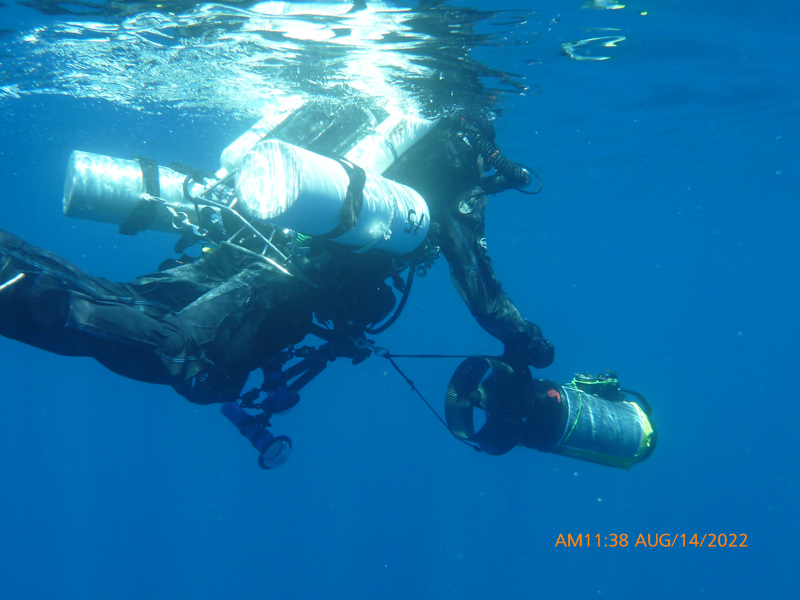 Diver Evan Kovacs of Marine Imaging Technologies prepares to descend onto a B-24 debris field to conduct photo documentation
