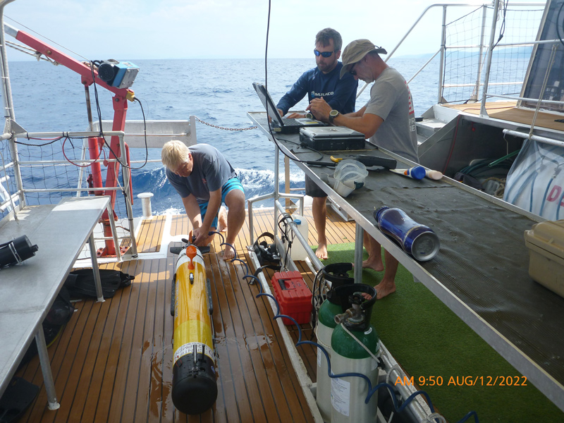 University of Delaware’s Mark Moline (left), professor of marine studies, rinses the AUV after its survey in Croatia while Matthew Breece, research scientist, and Erik White, senior engineer, download and analyze the data.