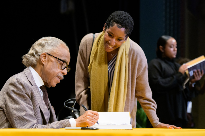 Al Sharpton signs copies of his book, “Righteous Troublemakers: Untold Stories of the Social Justice Movement in America.”