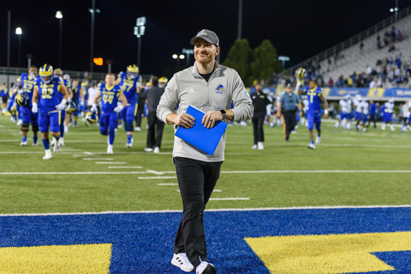 UD football’s head coach Ryan Carty is working to cultivate an aggressive, cutting-edge football program built on hard work, teamwork and “doing things the right way.”