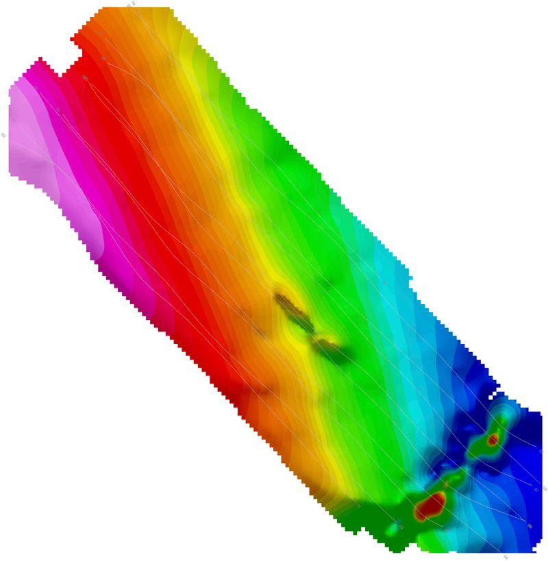  This image shows a composite map of magnetic anomalies identified in the vicinity of the newly confirmed shipwreck. In the center of the image is a long liner feature oriented from NW to SE which is centered over the shipwreck. To the SE of the shipwreck is another long and intense anomaly running NE to SW which coincides with a known water pipeline along the lakebed.