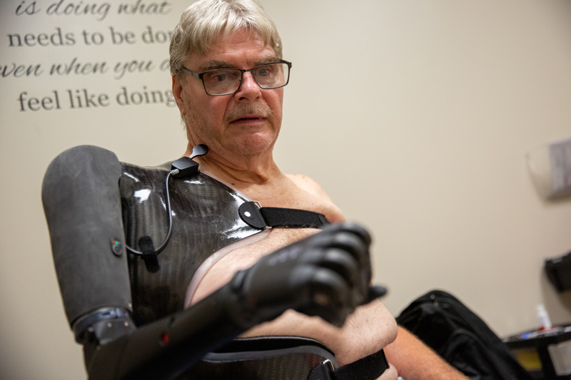 Joe Costello works to improve performance of his new bionic arm at Independence Prosthetics-Orthotics. Costello lost his arm after a motorcycle crash in 2021.