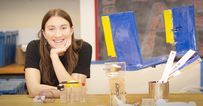 Recent mechanical engineering graduate Hannah Wiswell works on the zero-gravity turbulent flow facility’s fluid subsystem with a custom designed magnetic torque transmission.