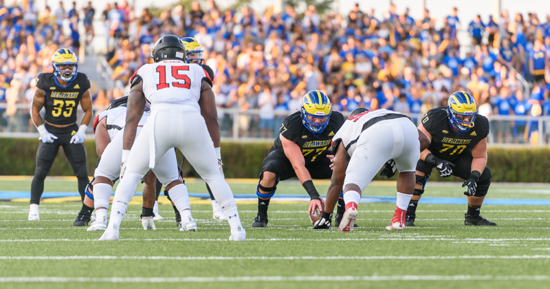 James Prince, seen snapping the ball in this photo, the only UD athlete majoring in food and agribusiness marketing and management.