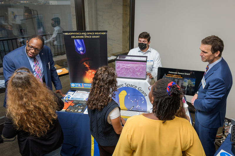 Dwight Higgin, assistant professor in UD’s Associate in Arts Program, talked about Delaware Space Grant and other research opportunities for students, sharing a table with Manuel Cuesta, graduate research assistant, and Professor Michael Shay of the Department of Physics and Astronomy. Dwight Higgin, assistant professor in UD’s Associate in Arts Program, talked about Delaware Space Grant and other research opportunities for students, sharing a table with Manuel Cuesta, graduate research assistant, and Professor Michael Shay of the Department of Physics and Astronomy.