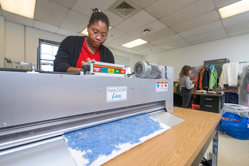 UD senior Diadem Abayode gives shredded material new life in a sustainable recycled textile and apparel project funded through a National Science Foundation’s Convergence research grant. UD senior Diadem Abayode gives shredded material new life in a sustainable recycled textile and apparel project funded through a National Science Foundation’s Convergence research grant.