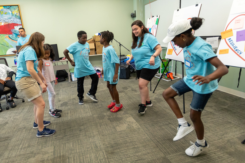 At Camp Dream. Speak. Live., held for the first time on UD’s STAR Campus, kids who stutter learn to be themselves. They learn strategies to become effective communicators and take time out for fun. Here, students dance to a song carefully selected by DJ Juan Cortez — Lovely Day by Bill Withers, a person who stutters. 