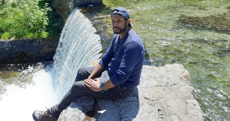 Endalkachew Kebede, a doctoral student in the Department of Geography and Spatial Sciences pictured here during his time studying in Europe, grew up in Ethiopia and faced the challenges of water scarcity firsthand. Because of his experience, he developed a deep interest in studying water and trying to discover a way he could help with a scientific contribution to resolving the water crisis in his country and beyond its borders.