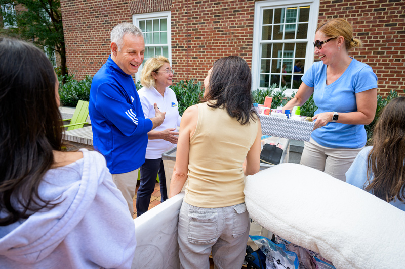 UD President Dennis Assanis and First Lady Eleni Assanis greet students and parents as they move into residence halls.
