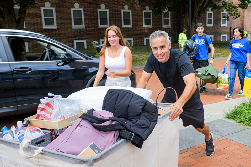 Despite some light showers early in the day, the excitement on the University of Delaware campus was palpable on Friday, Aug. 25, during the first day of move-in, as parents and family members unloaded microwaves, coffeemakers, sports gear, bedding, posters and more. Blue Hen Helpers — representing a variety of UD clubs, organizations and athletic groups — assisted incoming students settle into their new homes.