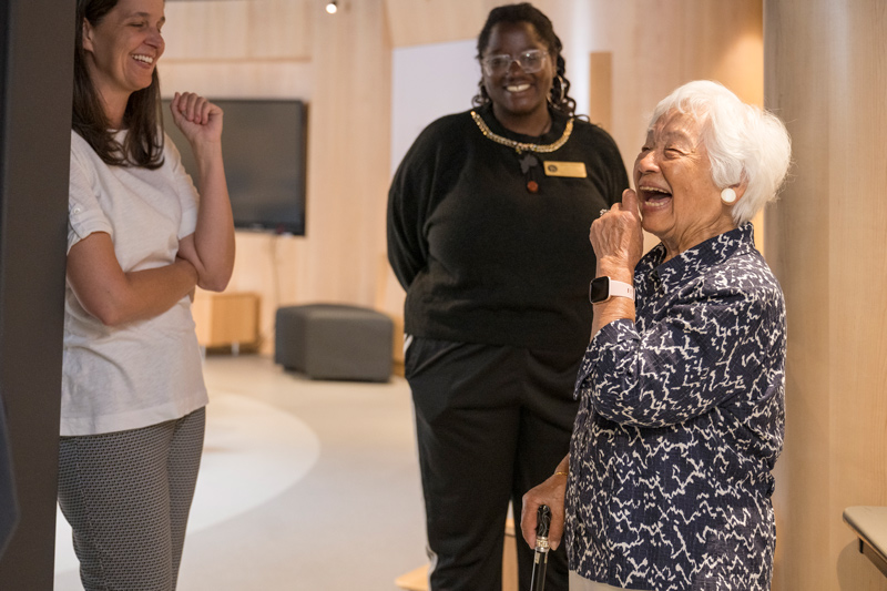 A joyful Hong tours UD’s Center for Intercultural Engagement alongside student associate Dulcine Stephens (center) and assistant vice president for student life philanthropy Stacey Muzzi (left)