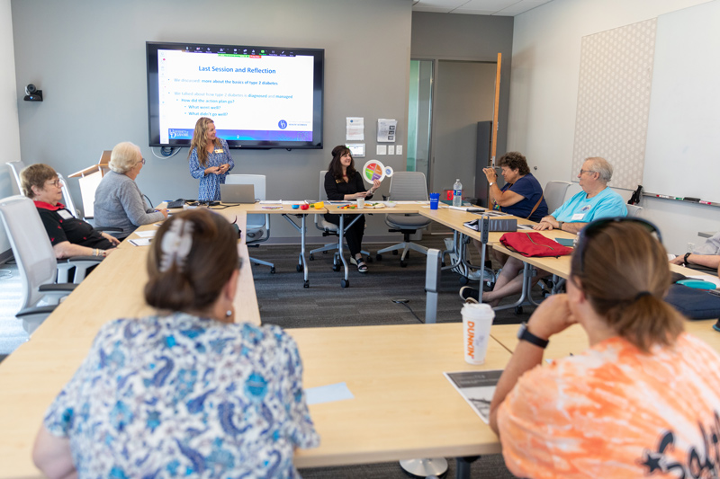 Director of UD’s Nutrition Clinic Donna Paulhamus (seated) and Tara Leonard, director of UD’s Health Coaching Clinic, lead the Prevent T2 program, where participants meet weekly as a group in the STAR Tower to receive health and wellness education, health coaching, and exercise support. Director of UD’s Nutrition Clinic Donna Paulhamus (seated) and Tara Leonard, director of UD’s Health Coaching Clinic, lead the Prevent T2 program, where participants meet weekly as a group in the STAR Tower to receive health and wellness education, health coaching, and exercise support.
