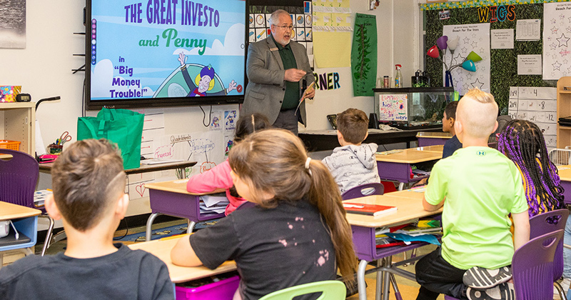 Third-graders are quick to suggest answers to banker Randy Kunkle’s questions during Teach Children to Save Day at R. Elisabeth MacClary Elementary in Newark. Third-graders are quick to suggest answers to banker Randy Kunkle’s questions during Teach Children to Save Day at R. Elisabeth MacClary Elementary in Newark.