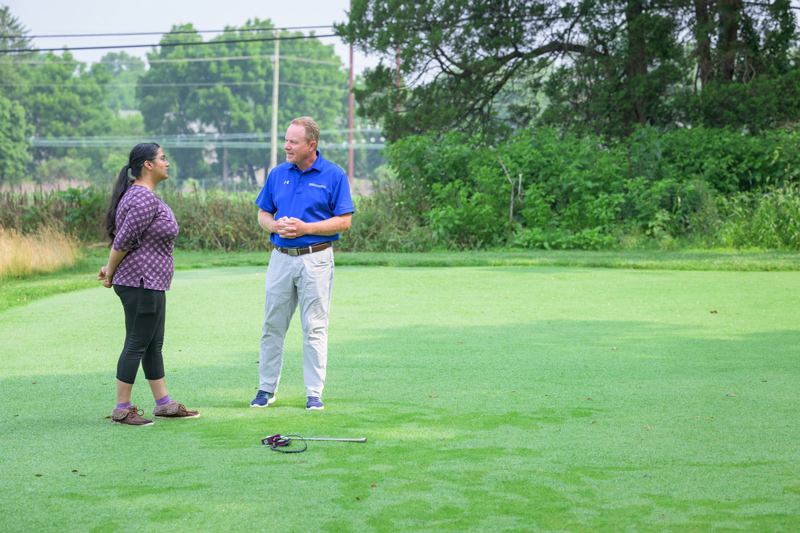 University of Delaware researchers and collaborators are studying the beneficial properties of UD1022, a UD-patented beneficial bacteria, against fungal pathogens that affect turfgrass, such as creeping bent grass, found on golf courses and other professional managed fields. Pictured here are Charanpreet Kaur, a doctoral student in in the College of Agriculture and Natural Resources (left) and Erik Ervin, UD’s resident turfgrass expert and chair and professor of plant and soil sciences. 