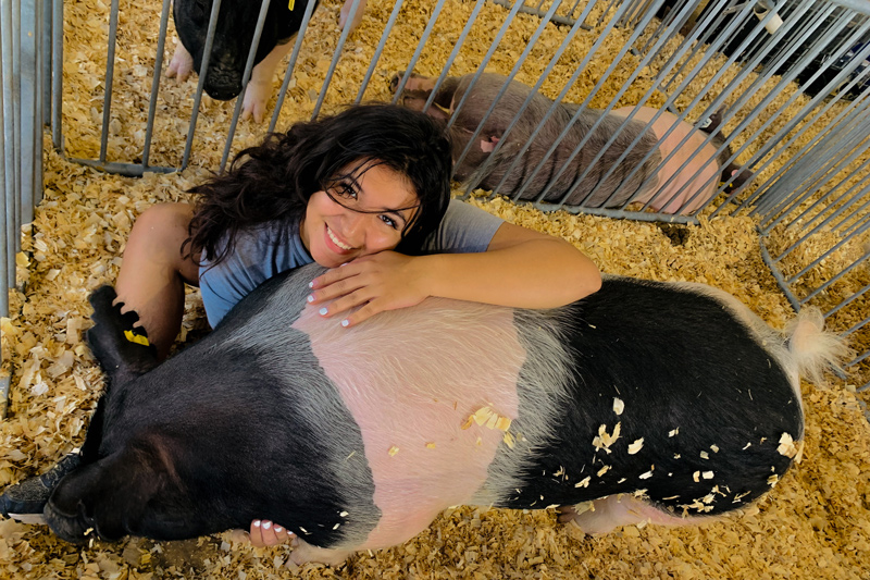 Cruz discovered her love for animals and agriculture in high school, where she pursued the animal science career pathway and was involved in the Future Farmers of America (FFA) student organization at Woodbridge High School. As part of a school program, she spent the summer raising a pig, whom she named Kenny, and showed him at the state fair. Cruz discovered her love for animals and agriculture in high school, where she pursued the animal science career pathway and was involved in the Future Farmers of America (FFA) student organization at Woodbridge High School. As part of a school program, she spent the summer raising a pig, whom she named Kenny, and showed him at the state fair.