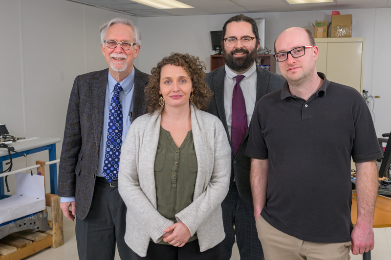 From left to right: Willett Kempton, professor of marine science and policy and electrical and computer engineering; Becky Cox, administrative assistant; Rodney McGee, director of the Center for Transportation Electrification; and Garrett Ejzak, postdoctoral researcher.