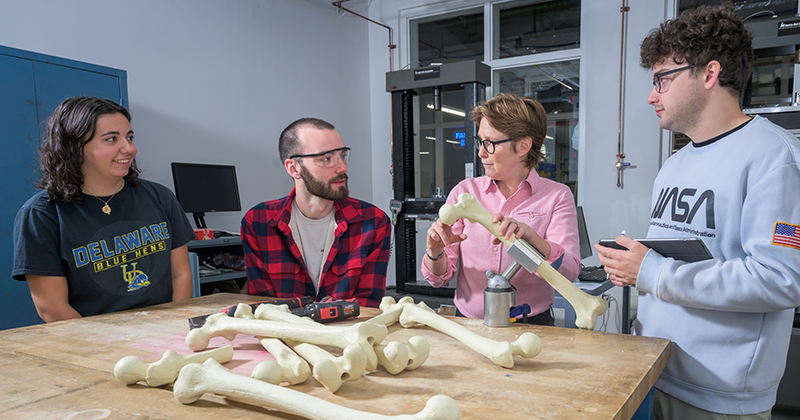 Buckley (second right), pictured here in Spencer Lab with Nikki Pilla (far left), Jensen Gaither (second from left) and Ben Caro (far right), with the Sawbones models that can be used in the newly launched orthopedics curriculum. 