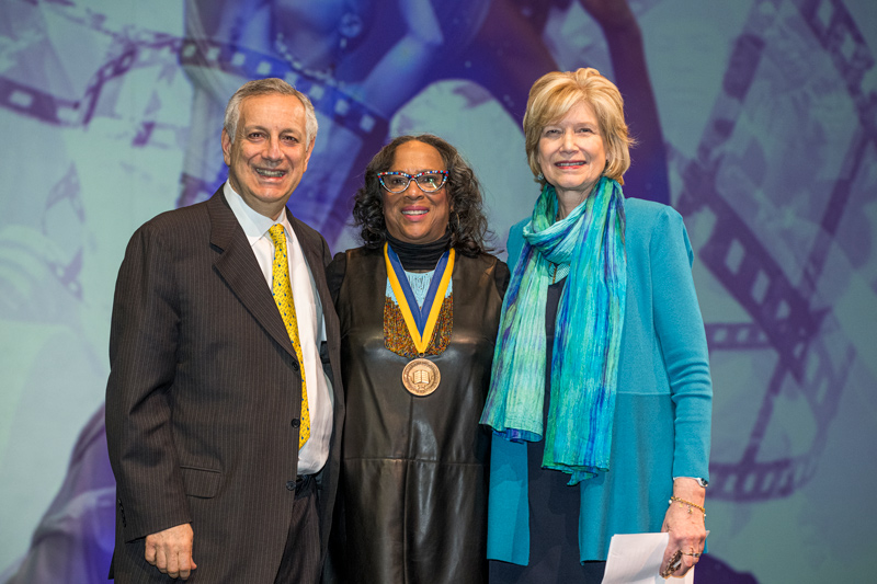 University of Delaware President Dennis Assanis (left) joined the University’s Medal of Distinction honoree Raye Jones Avery (center) and Debra Hess Norris for the award presentation. Norris is a member of UD’s Board of Trustees, the Unidel Henry Francis du Pont Chair in Fine Arts and director of the Winterthur/University of Delaware Program in Art Conservation. The award, made just before the final performance of “Suite Blackness” on Feb. 18 at the Roselle Center for the Arts, is UD’s highest non-academic award.