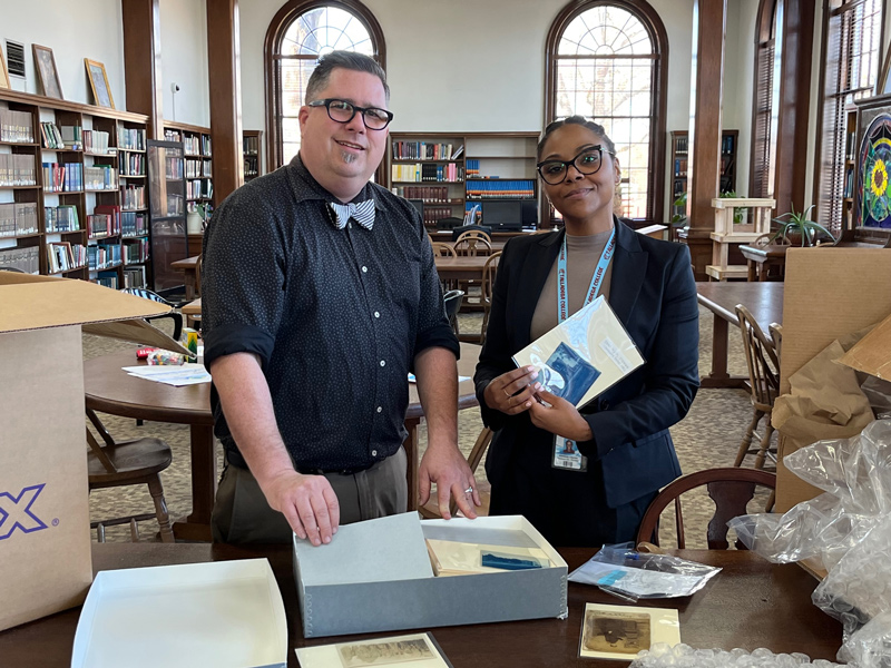 Talladega College staff members Perry Trice (left) and Kimberly Jacobs hold the preserved photograph collection after restoration by graduate students in the Winterthur/University of Delaware Program in Art Conservation. Talladega College staff members Perry Trice (left) and Kimberly Jacobs hold the preserved photograph collection after restoration by graduate students in the Winterthur/University of Delaware Program in Art Conservation.