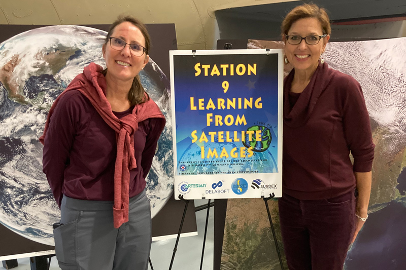 In an effort to raise geography awareness throughout the state of Delaware, faculty members and staff from the University of Delaware’s Department of Geography and Spatial Sciences and the Delaware Center for Geographic Education engaged in outreach programs at local middle schools and hosted competitions to raise awareness about the power of geography as well as possible career opportunities that could be attained through the field. Tracy DeLiberty (Left) and Mary Schorse (right) are pictured here at the annual Geographic Information Systems (GIS) Day Field Trip Event at the Dover Air Mobility Command Museum.