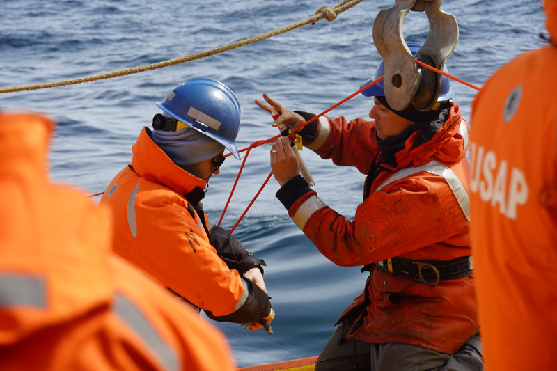 UD students Jake Gessay (left) and Michael Cappola (right) recover sensors from an oceanographic mooring that collected ocean current, temperature and salinity data during 2022.