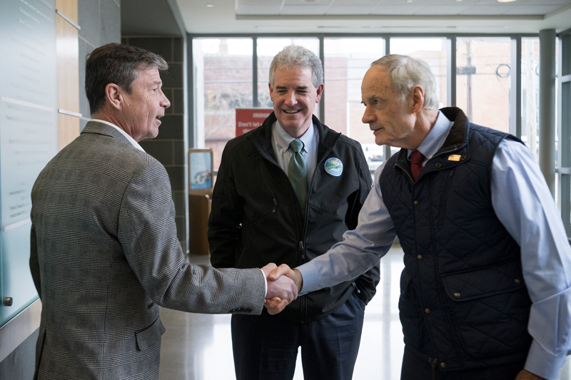 Gerald Kauffman (left), director of the Delaware Water Resources Center,  welcomes U.S. Sen. Tom Carper to the Harker Interdisciplinary Science and Engineering Laboratory at the University of Delaware. Carper and Shawn Garvin (center), secretary of Delaware’s Department of Natural Resources and Environmental Control, visited UD to get an update on environmental research that may be of interest to the U.S. Army Corps of Engineers. Carper, who chairs the Senate Committee on Environment and Public Works, was instrumental in developing the Water Resources Development Act of 2022 which authorizes more than $37 billion in Army Corps projects and research.