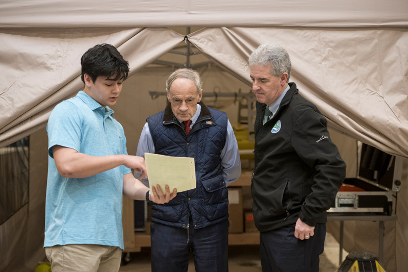 Harrison Fleetwood (left), a junior engineering major at the University of Delaware, talks about the placement of underwater sensors that provide data to researchers during a visit of U.S. Sen. Tom Carper (center) and Shawn Garvin, secretary of Delaware’s Department of Natural Resources and Environmental Control, to the Center for Applied Coastal Research. Harrison Fleetwood (left), a junior engineering major at the University of Delaware, talks about the placement of underwater sensors that provide data to researchers during a visit of U.S. Sen. Tom Carper (center) and Shawn Garvin, secretary of Delaware’s Department of Natural Resources and Environmental Control, to the Center for Applied Coastal Research.