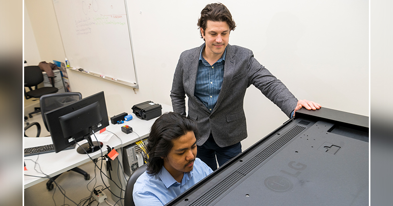 Cashaback (right) and doctoral student Jan Calalo Cashaback (right) and doctoral student Jan Calalo