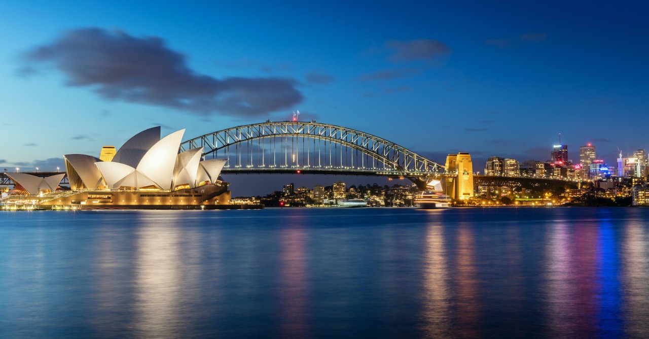 Sydney skyline at twilight. Panorama of the Sydney Skyline. The Sydney Opera House small on the left side, Sydney Harbour Bridge in the middle. Twilight Scenic Sydney Panorama. Sydney, Australia. Canon 5DSR 50MPixel Panorama.