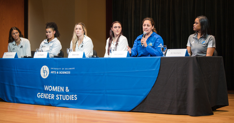 UD Women’s Volleyball team coach Kimberly Lambert makes a point during the Fifty Years of Title IX: Saluting Women’s Sports event, part of the Women and Gender Studies 50th anniversary series. UD Women’s Volleyball team coach Kimberly Lambert makes a point during the Fifty Years of Title IX: Saluting Women’s Sports event, part of the Women and Gender Studies 50th anniversary series.