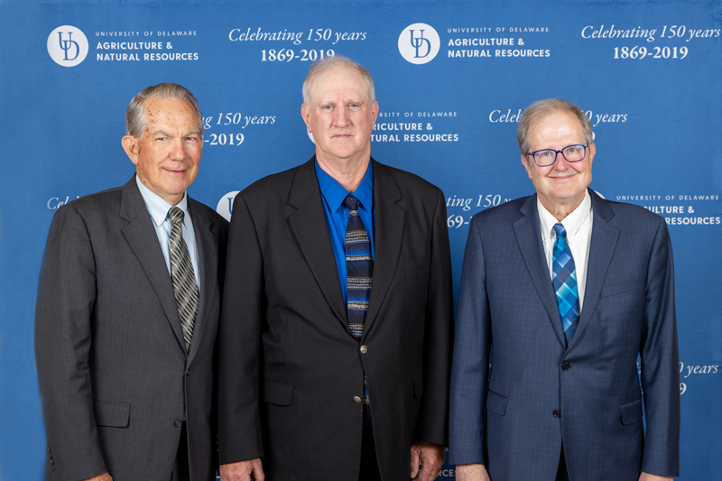 Bob Mulrooney (left), retired extension plant pathologist and Worrilow honoree (2008), represented the nomination committee poses with Gordon Johnson (center) and Interim Dean Calvin Keeler (right) at the College of Agriculture and Natural Resources’ prestigious Worrilow Award during a May 2023 ceremony. 