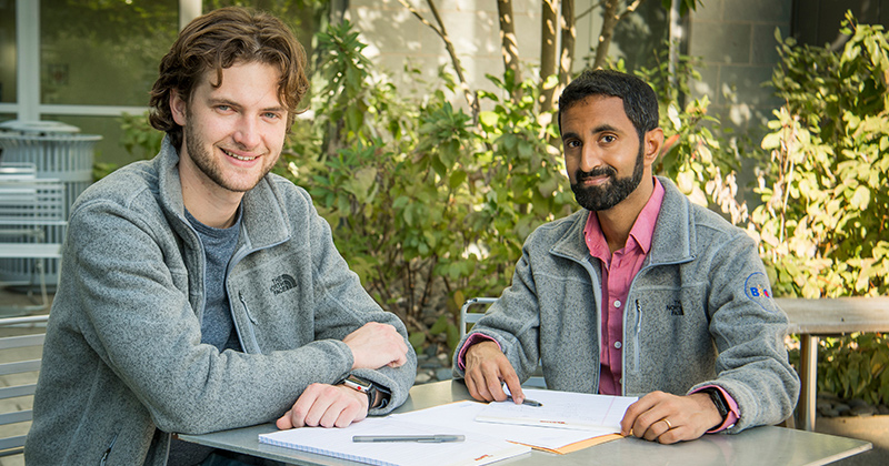 UD Assistant professor Aditya Kunjapur (right) and doctoral candidate Neil Butler have a new paper in Nature Chemical Biology, in which they report how they created bacteria that can synthesize an unnatural amino acid, with potential opportunities to enhance live vaccines. 
