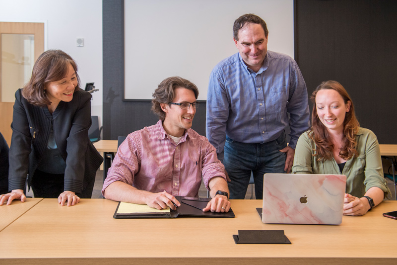 Jonathan Hicks and Rachel Keown (both seated) are among the first students selected for UD’s Computational Biology, Bioinformatics and Biomedical Data Science (CBB) T32 training program. They are shown with program directors Shawn Polson and Cathy Wu. Keown has her sights set on a career in biotechnology, and Hicks as a data scientist in the medical field.