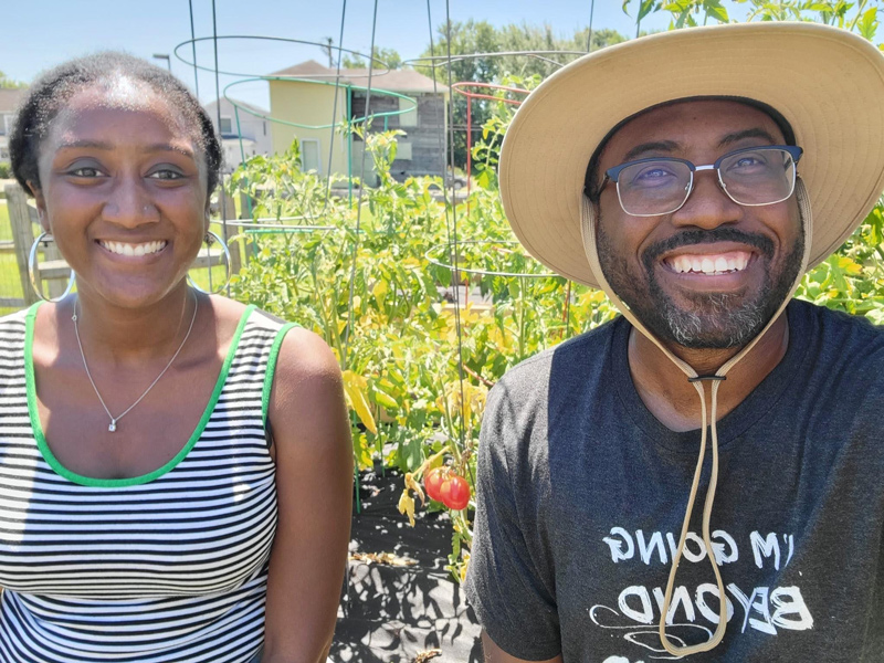 Austen-Monet McClendon (left) works with Reverend Heber Brown, III, founder of the Black Church Food Security Network. Austen-Monet McClendon (left) works with Reverend Heber Brown, III, founder of the Black Church Food Security Network.