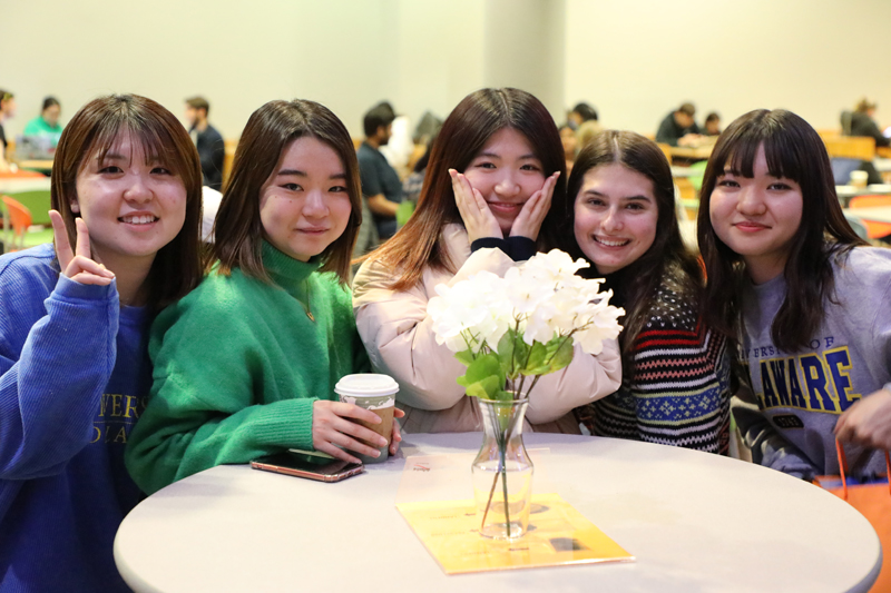 Maika Inoue (right), 1st place ELI winner from Japan, gathered with friends during the 2022 international student essay contest award ceremony last fall. 