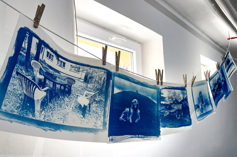 Photos hang on a clothesline