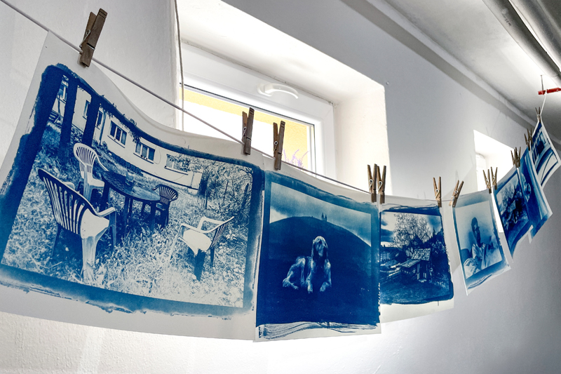 Photos hang on a clothesline Photos hang on a clothesline